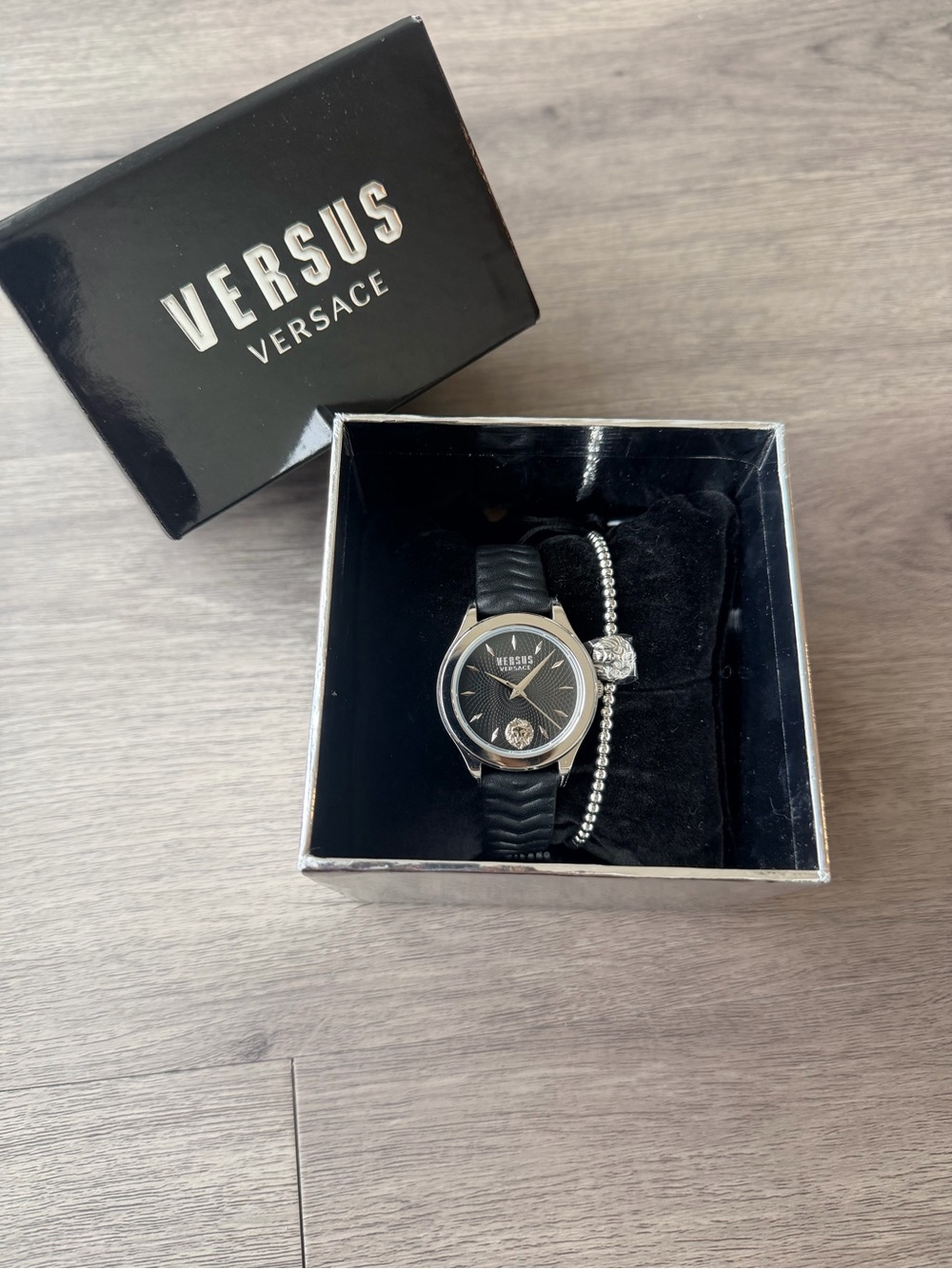 VERSUS Versace Women’s Black Dial Watch with Silver Bracelet Accent